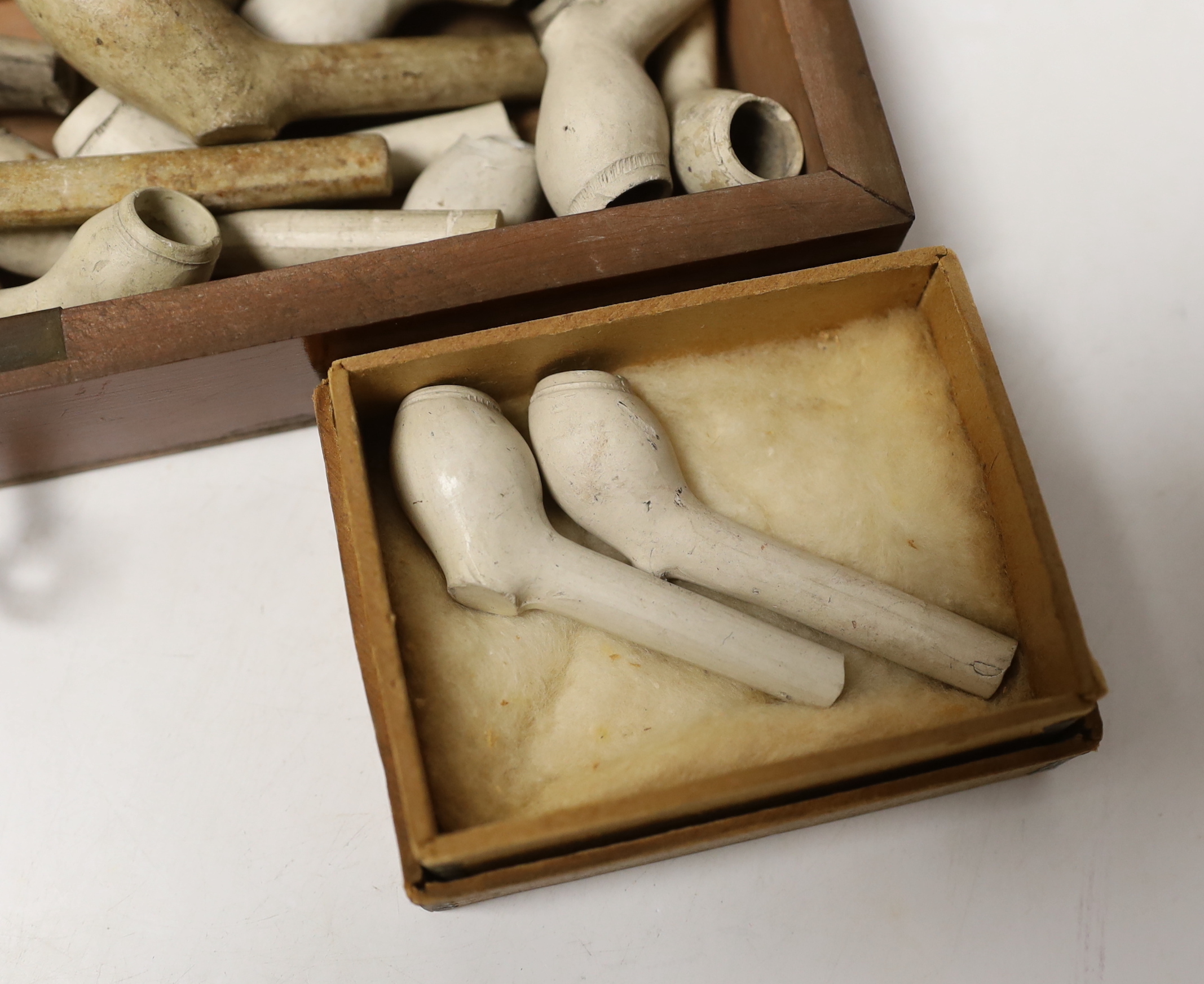 A collection of assorted clay pipes